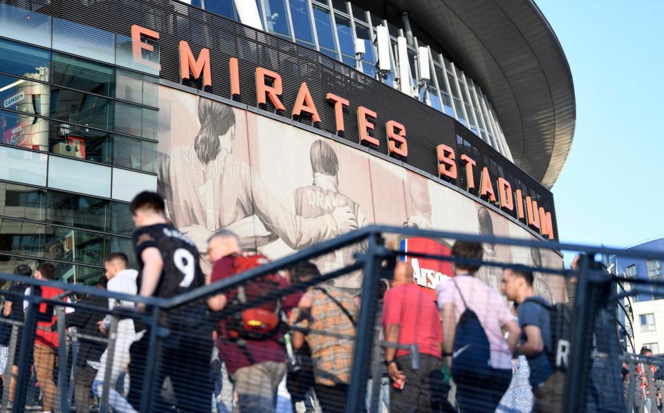 Arsenal fans arrive at the Emirates