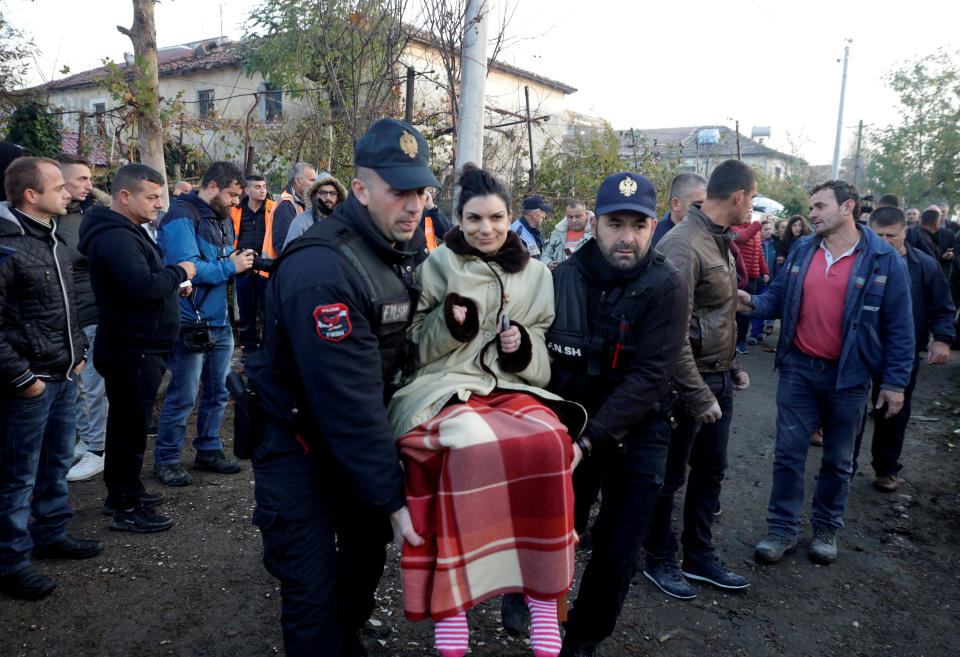 Emergency workers carry a women in Thumane, after an earthquake shook Albania, November 26, 2019. (Photo: Florion Goga/Reuters)