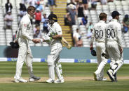 New Zealand captain Tom Latham, second left, shakes hands with England's Zak Crawley, left, after their win on the fourth day of the second cricket test match between England and New Zealand at Edgbaston in Birmingham, England, Sunday, June 13, 2021. (AP Photo/Rui Vieira)