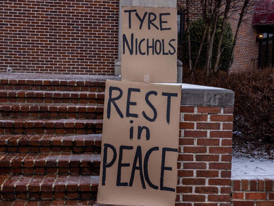 Signs outside the Memphis church where Tyre Nichols' funeral service took place on Wednesday.