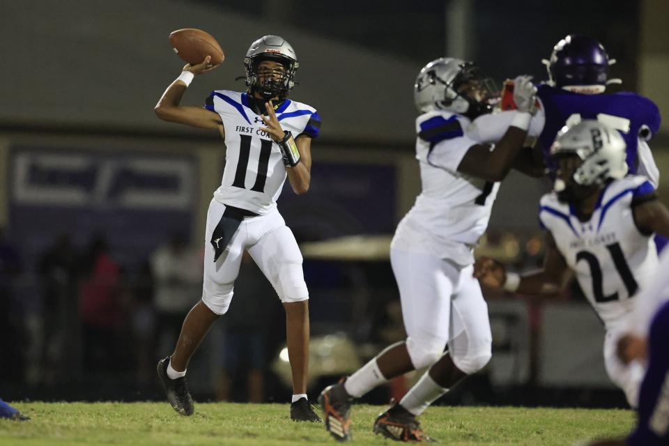 First Coast's Rodney Tisdale Jr. (11) looks to pass during a 2022 game at Fletcher.