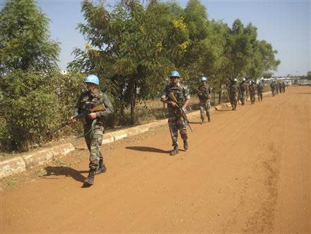 Soldiers from the peacekeeping force of the United Nations Mission in the Republic of South Sudan (UNMISS) participate in a routine patrol at their compound in the outskirts of South Sudan's capital Juba, in this December 16, 2013 handout provided by UNMISS. REUTERS/UNMISS/Handout via Reuters