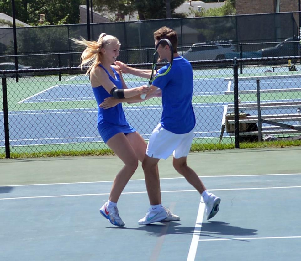 Clear Spring's Kayda Shives and Andrew Keller hug after winning the Maryland Class 1A mixed doubles championship on May 28 at the Wilde Lake Tennis Club.