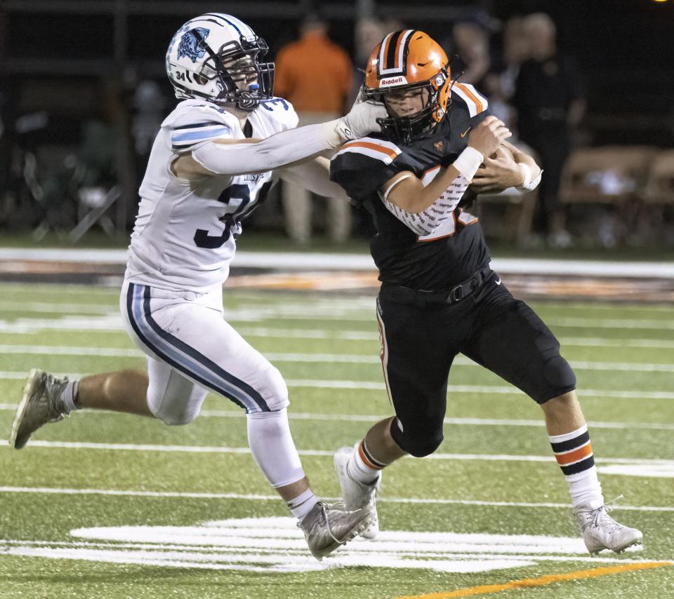 Louisville’s Will Ramsey (34) pursues Hoover’s Luke Roach, Sept. 9, 2022.