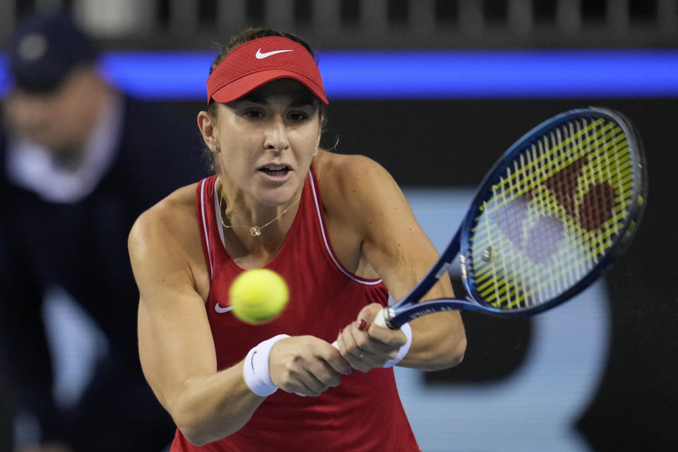 Belinda Bencic of Switzerland returns a ball during the semi-final match against Karolina Pliskova of Czech Republic, at the Billie Jean King Cup, at the Emirates Arena in Glasgow, Scotland, Saturday, Nov. 12, 2022. (AP Photo/Kin Cheung)