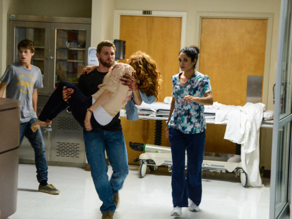 "Speak of the Devil" - Joe (Colin Ford) helps Barbie (Mike Vogel) brings Julia (Rachelle Lefevre) to the clinic when she is wounded on "Under the Dome."