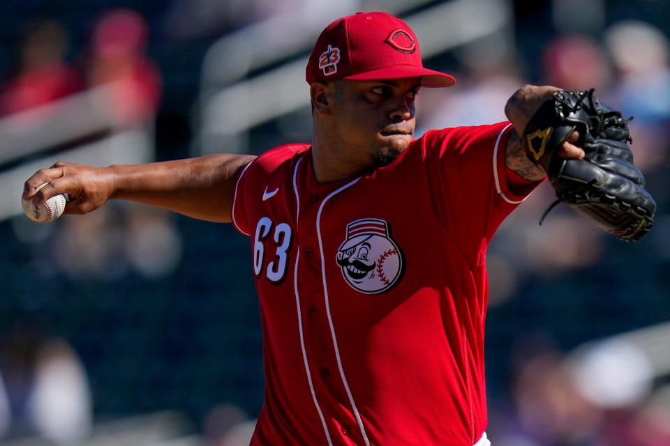 Cincinnati Reds pitcher Fernando Cruz (63) throws a pitch in the seventh inning of the MLB Cactus League spring training game between the Cincinnati Reds and the Cleveland Guardians at Goodyear Ballpark in Goodyear, Ariz., on Saturday, Feb. 25, 2023.