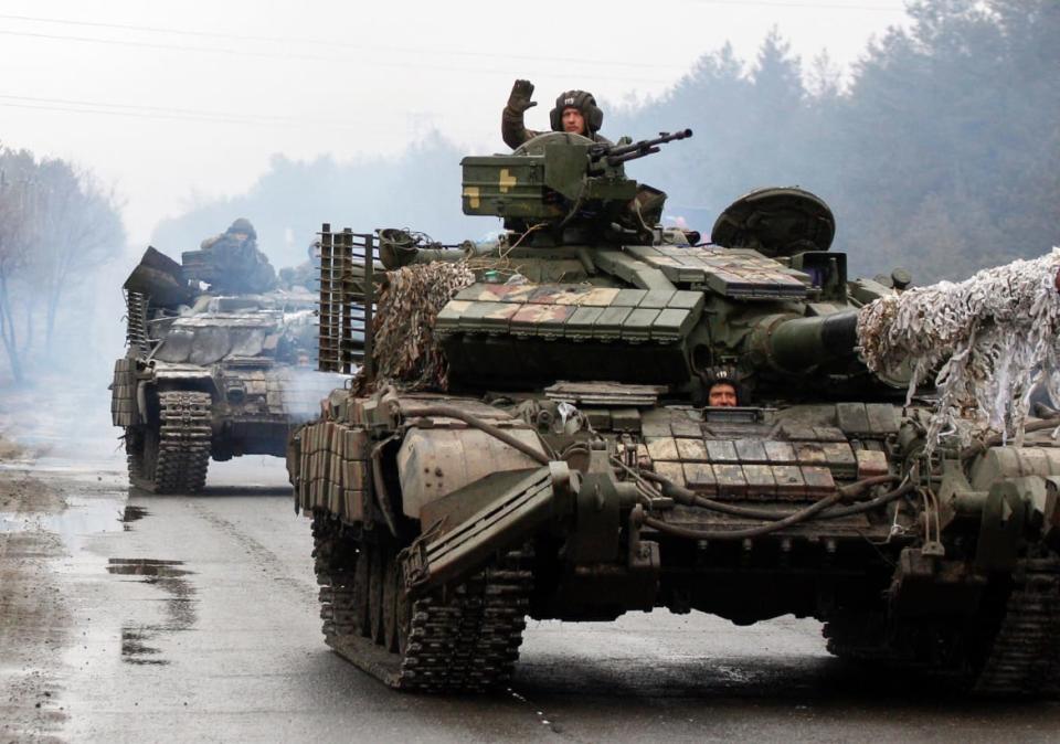 <div class="inline-image__caption"><p>Ukrainian servicemen ride on tanks toward the front line in the Lugansk region of Ukraine on Feb. 25, 2022.</p></div> <div class="inline-image__credit">Anatolii Stepanov/AFP via Getty</div>