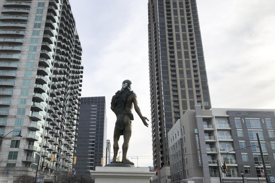 The back side of a statue depicting Chief Tomochichi, a Muscogee native who signed the 1733 Treaty of Savannah that launched the Georgia colony, pictured here on Dec. 20, 2021 in its temporary location in Atlanta. Muscogee Creek Nation historians say their ancestor would have been fully clothed, not clutching a bear pelt that doesn't cover his rear end. (AP Photo/Michael Warren)