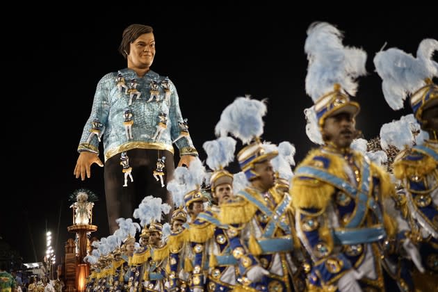 Samba performers parade in front of a float with a statue of American actor Jack Black during the Carnival celebrations in Rio, Brazil, on February 9, 2016. More <a href="http://www.theatlantic.com/photo/2016/02/carnival-2016-around-the-world/462015/?utm_source=yahoo" rel="nofollow noopener" target="_blank" data-ylk="slk:here;elm:context_link;itc:0;sec:content-canvas" class="link ">here</a>. (Leo Correa / AP)