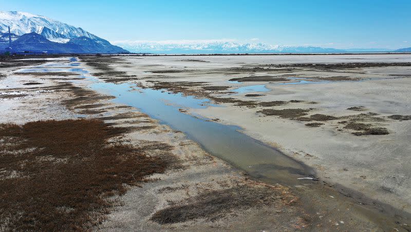 Water is receding in the Great Salt Lake in Salt Lake City on Friday, March 17, 2023. One of the world’s largest hypersaline lakes, the Great Salt Lake is on the verge of collapse due to climate change, drought and population pressures that have reduced inflows and shrunk the lake by more than two-thirds.