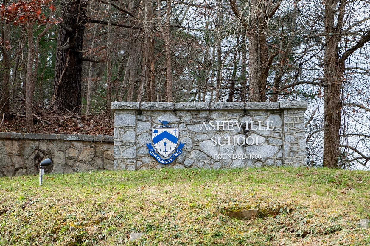 A stone sign marks the entrance to Asheville School on the west side of Asheville on Dec. 1, 2020. 