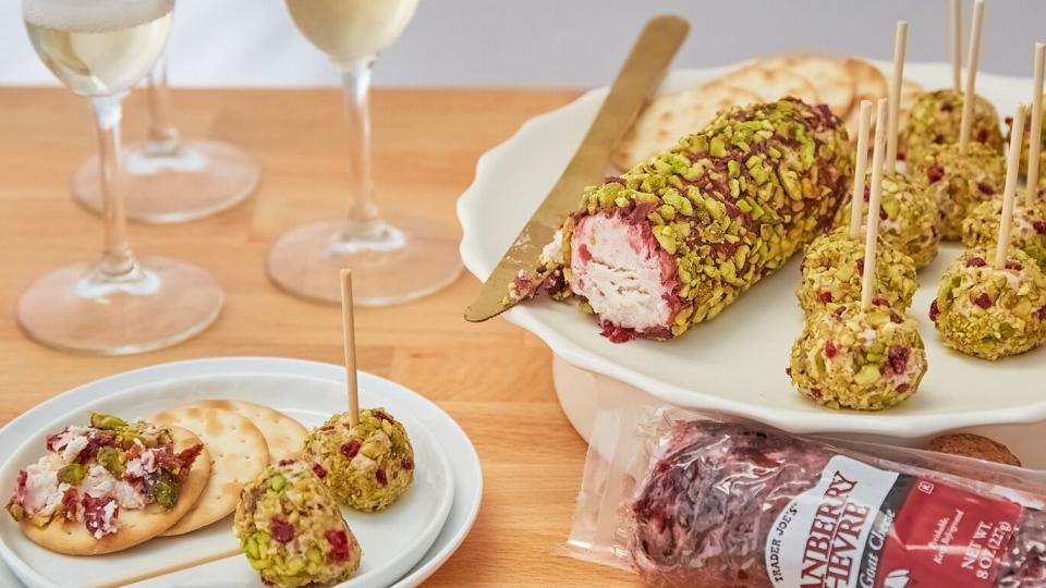 trader joe's cranberry chévre goat cheese rolled with crushed pistachios on a platter and made into a appetizer bite