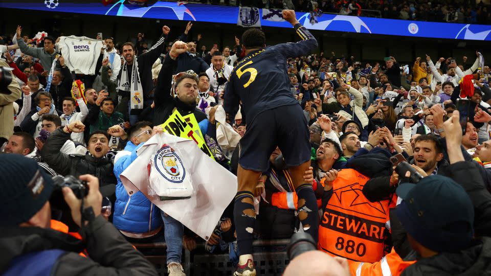 Jude Bellingham celebrates with Real Madrid fans after winning the Champions League quarterfinal against Manchester City. - Molly Darlington/Reuters