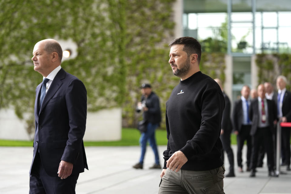 Germany's Chancellor Olaf Scholz, left, walks with Ukraine's President Volodymyr Zelenskyy at the chancellery in Berlin, Germany, Sunday, May 14, 2023. Ukrainian President Volodymyr Zelenskyy arrived in Berlin early Sunday for talks with German leaders about further arms deliveries to help his country fend off the Russian invasion and rebuild what's been destroyed by more than a year of devastating conflict. (AP Photo/Matthias Schrader)