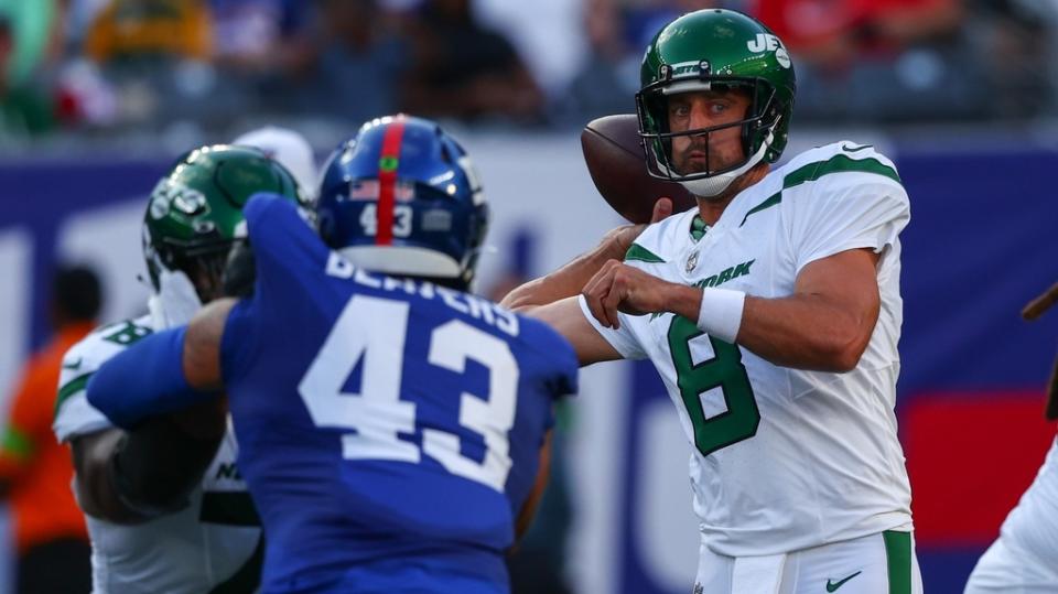 Aug 26, 2023; East Rutherford, New Jersey, USA; New York Jets quarterback Aaron Rodgers (8) throws a pass against the New York Giants during the first half at MetLife Stadium.
