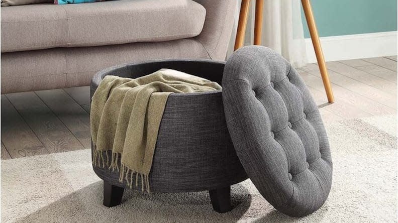 It may look like your average ottoman, but there's storage space inside.