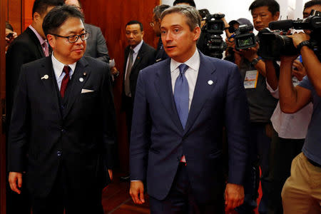 Japan's Trade Minister Hiroshige Seko (L) talks with Canada's International Trade Minister Francois-Philippe Champagne after their bilateral talk during the APEC Ministers Responsible For Trade (APEC MRT 23) meeting in Hanoi, Vietnam May 20, 2017. REUTERS/Kham