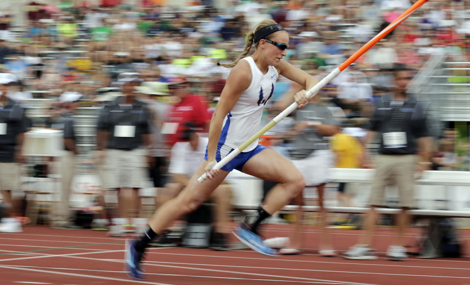 Emory Rains High School's Charlotte Brown competes in the Girls 3A pole vault in the UIL State Track & Field meet, Friday, May 9, 2014, in Austin, Texas. Brown, a pole vaulter who happens to be legally blind, starts on the clap from her coach and counts her steps on her approach. (AP Photo/Eric Gay)