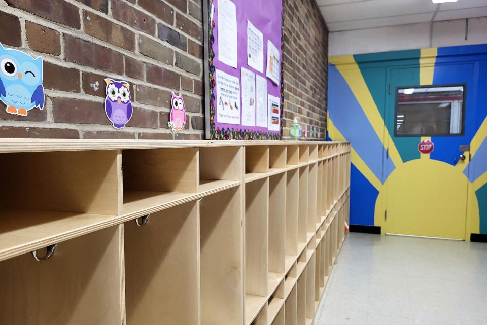 Cubbies line a hallway on Thursday, June 8, 2023, at the YMCA's Warm World Childcare and Education Center. According to the state, they're licensed capacity is 109.