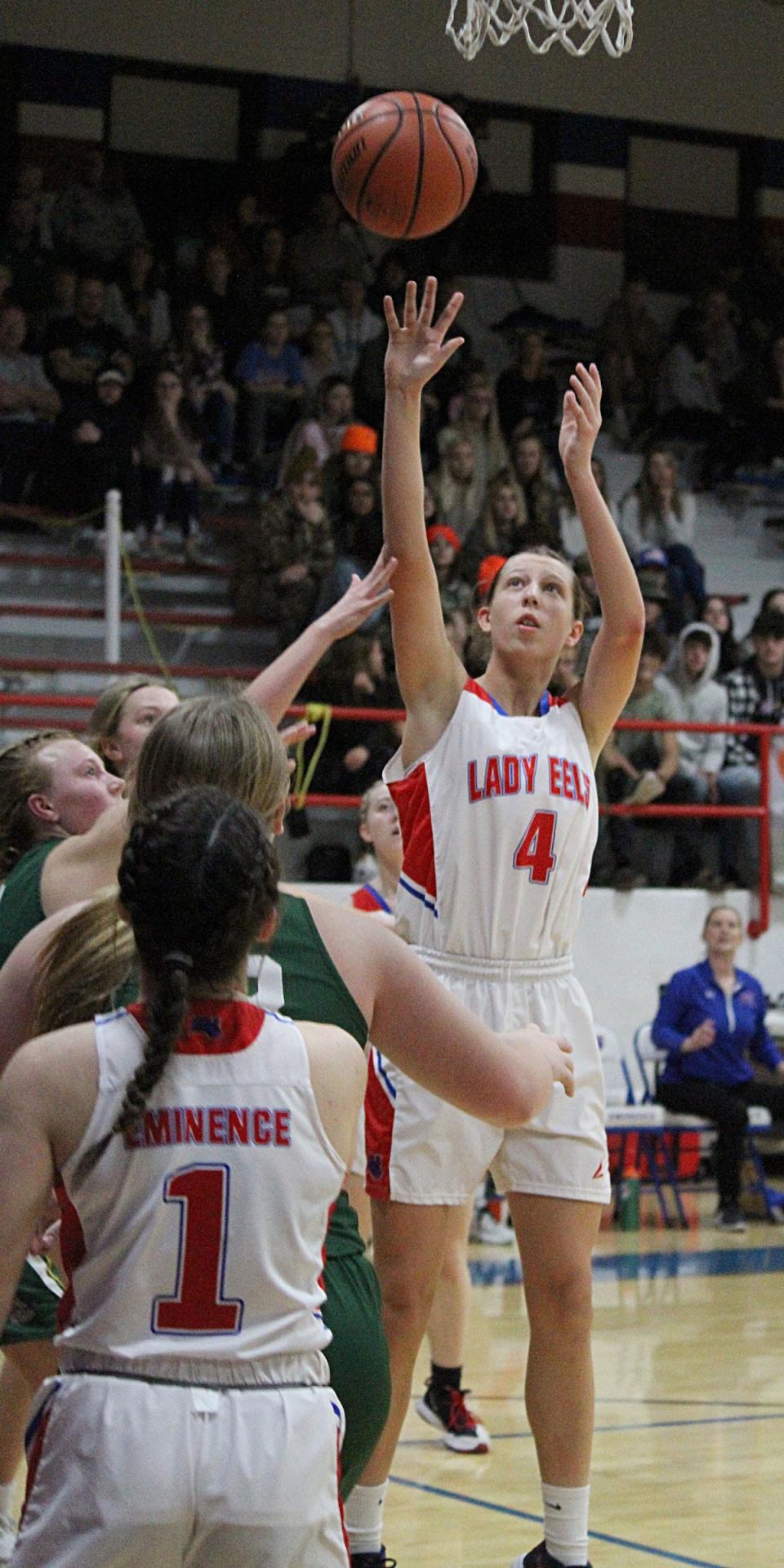 An Eminence player takes a shot over Monrovia defenders during Wednesday's Powder Keg game at Eminence.