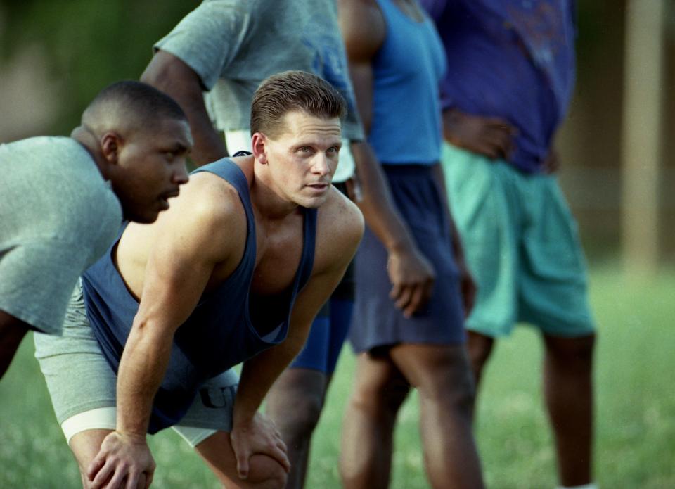 The Tennessean sports reporter Mike Organ, second from left, rubs elbows with some former area high school and college football stars during tryouts for a new minor league professional team, the Tennessee Generals, as an assignment for the paper at Tennessee State University July 3, 1993.