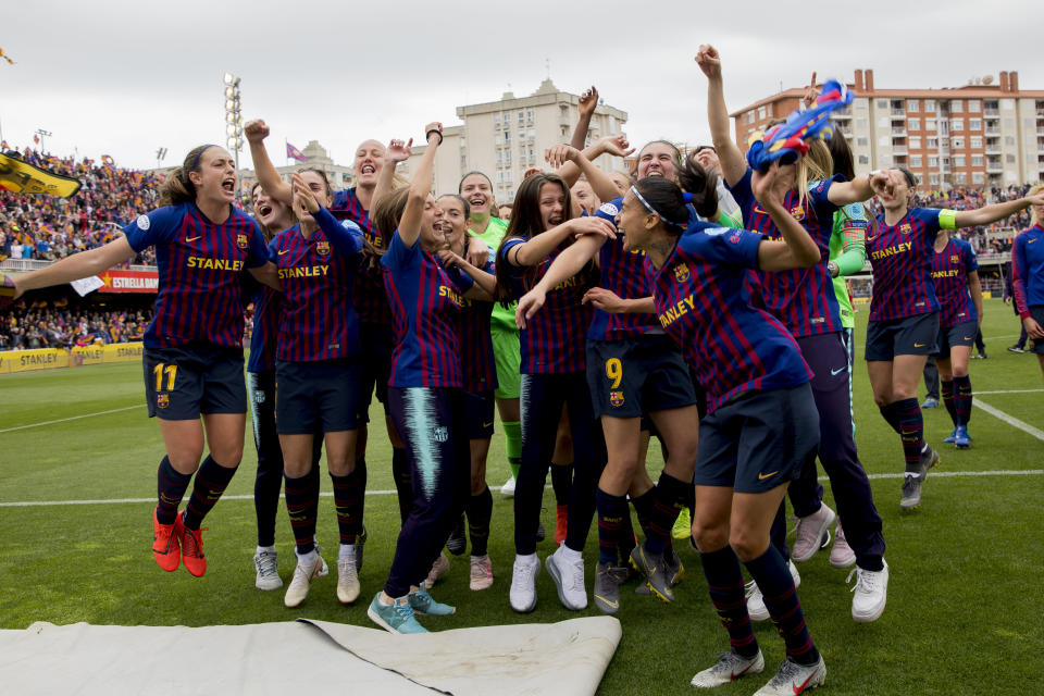 FC Barcelona players celebrate at the end of the Women's Champions League semifinal second leg soccer match between FC Barcelona and Bayern Munich at the Miniestadi stadium in Barcelona, Spain, Sunday, April 28, 2019. (AP Photo/Joan Monfort)