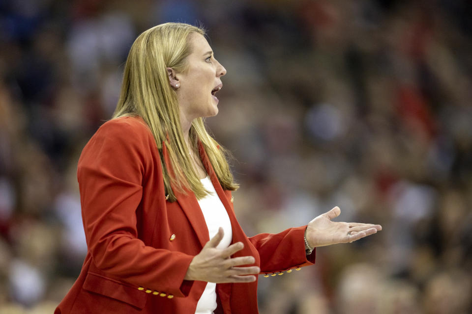 Louisville head coach Dani Busboom reacts to a call by the official against Pittsburgh during the semifinals of the NCAA volleyball tournament, Thursday, Dec. 15, 2022 in Omaha, Neb. (AP Photo/John S. Peterson)