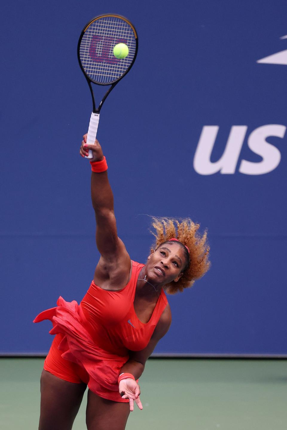<p>Serena Williams looks powerful as she serves the ball during her women's singles match against Kristie Ahn at the 2020 US Open in N.Y.C. </p>