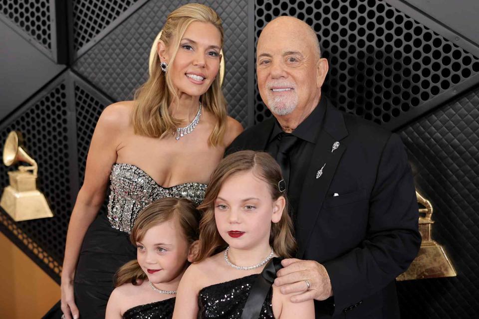 <p>Neilson Barnard/Getty</p> Billy Joel with his wife and daughters at the 2024 Grammys