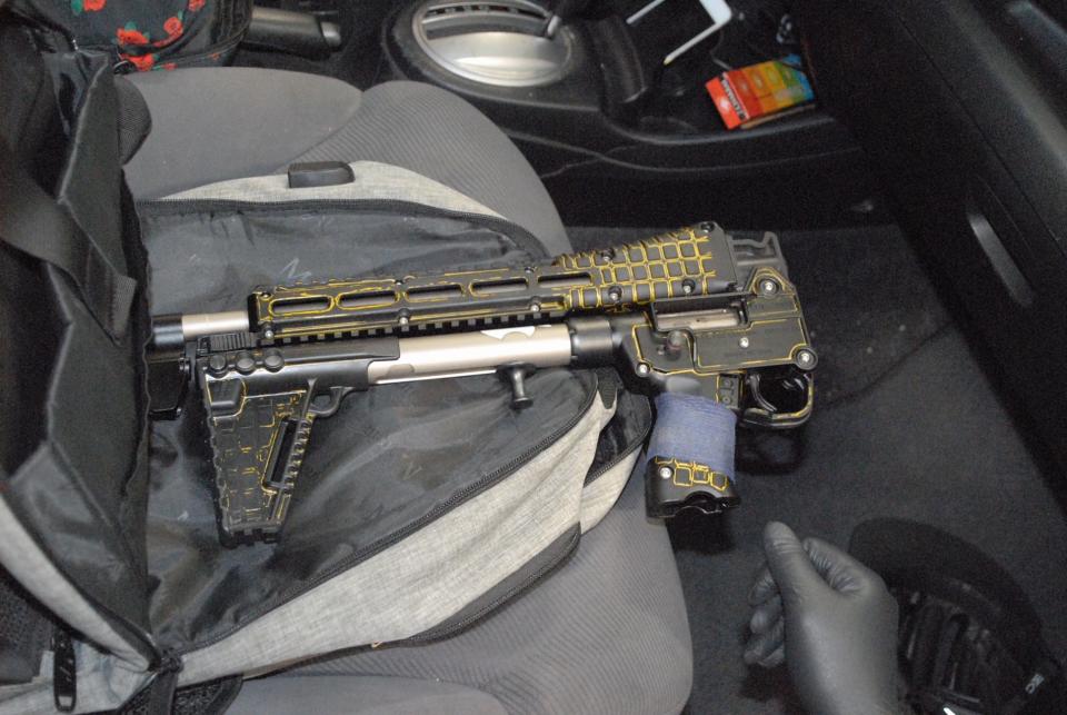 Photo released by Lake County Major Crime Task Force of a gun recovered from the front seat of  Robert “Bobby” Crimo’s car.  Crimo is accused of killing seven people during a mass shooting during a July 4 parade in Highland Park, Ill.