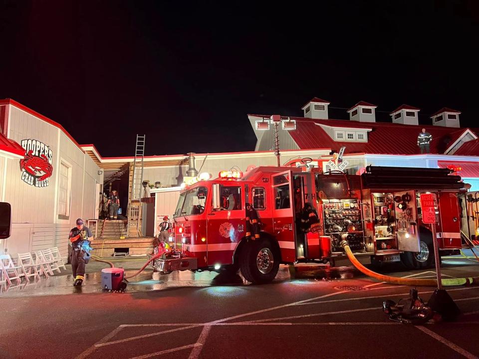 Firefighters from Ocean City and Berlin battle the fire that broke out at Hooper's in West Ocean City on Thursday, Aug. 3, 2023. All diners were safely evacuated from the restaurant.