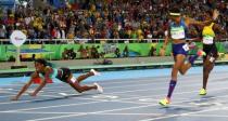 2016 Rio Olympics - Athletics - Final - Women's 400m Final - Olympic Stadium - Rio de Janeiro, Brazil - 15/08/2016. Shaunae Miller (BAH) of Bahamas throws herself across the finish line to win the gold medal. REUTERS/Kai Pfaffenbach