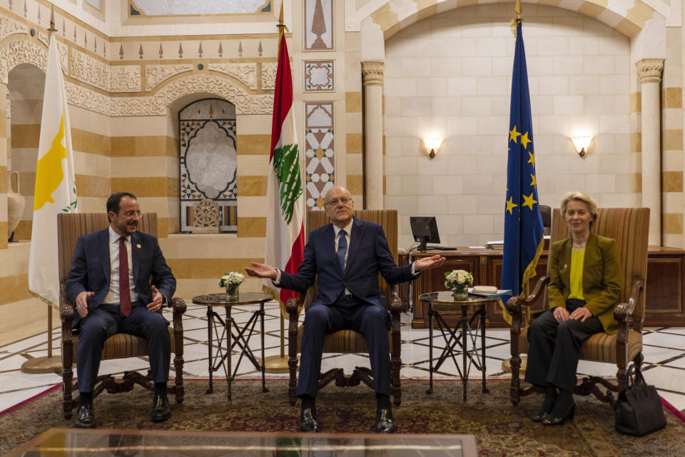 Lebanese caretaker Prime Minister Najib Mikati, center, welcomes Cyprus' president Nikos Christodoulides, left, and President of the European Commission Ursula von der Leyen before their meeting at the government palace in Beirut, Lebanon, Thursday, May 2, 2024. (AP Photo/Hassan Ammar)