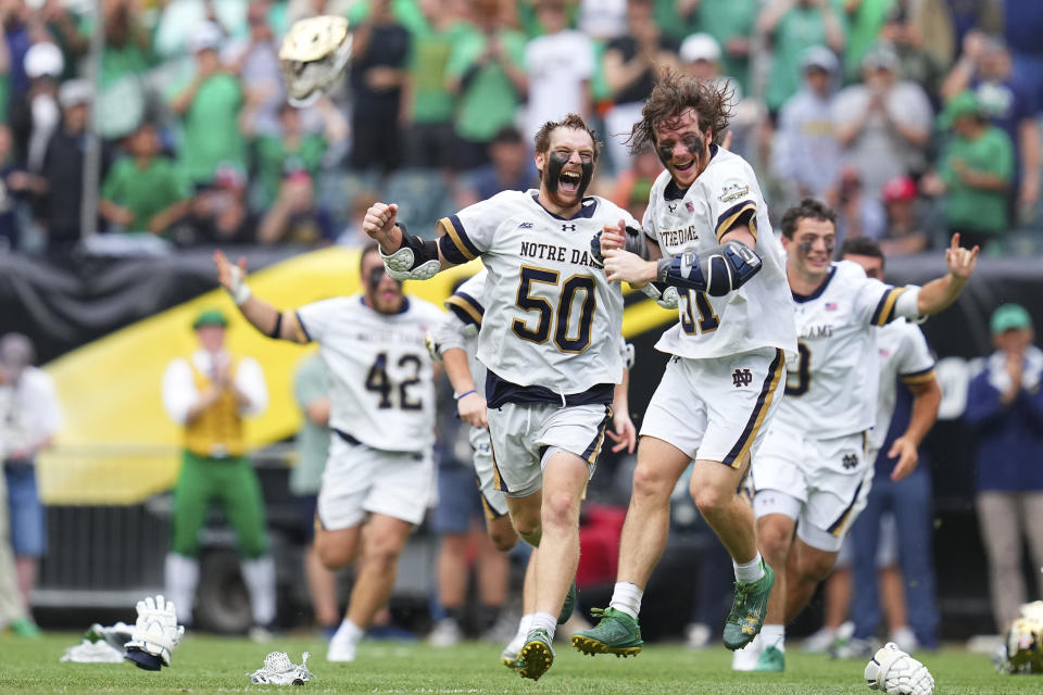 Pat (right) and Chris celebrate after winning Monday's national championship. (Mitchell Leff/Getty Images)