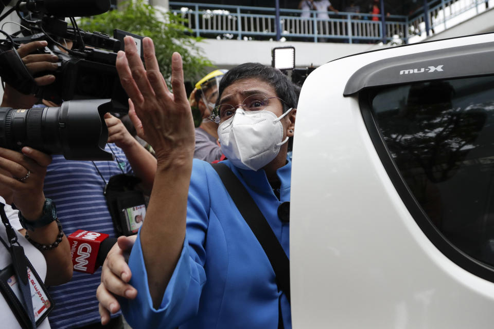 Rappler CEO and Executive Editor Maria Ressa gestures as she talks to reporters at the Pasig Regional Trial Court where she attended an arraignment related to tax evasion charges filed against her in Pasig, Manila, Philippines on Wednesday, July 22, 2020. (AP Photo/Aaron Favila)