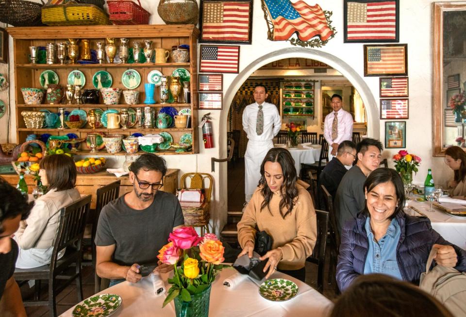 A "startling number of framed American flags" decorate the main dining room, Peterson writes.