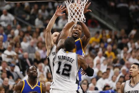 May 20, 2017; San Antonio, TX, USA; Golden State Warriors small forward Kevin Durant (35) is fouled while shooting by San Antonio Spurs shooting guard Manu Ginobili (behind) during the second half in game three of the Western conference finals of the NBA Playoffs at AT&T Center. Soobum Im-USA TODAY Sports