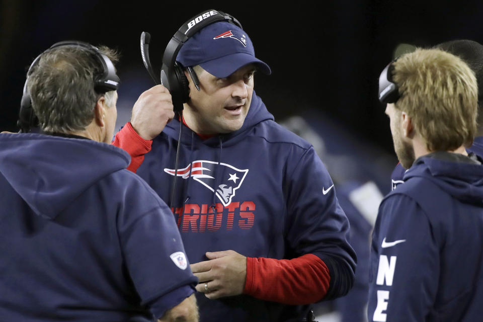 FILE - In this Oct. 10, 2019, file photo, New England Patriots special teams coach Joe Judge, center, speaks to head coach Bill Belichick, left, and safeties coach Steve Belichick, right, in the second half of an NFL football game in Foxborough, Mass. The New York Giants and Patriots assistant Joe Judge are working on a deal for him to become the team's head coach, a person familiar with the negotiations told The Associated Press The person spoke to the on condition of anonymity Tuesday, Jan. 7, 2020, because the deal is not done. (AP Photo/Elise Amendola, File)