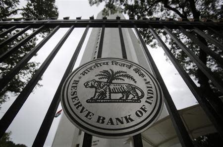 The Reserve Bank of India (RBI) seal is pictured on a gate outside the RBI headquarters in Mumbai July 30, 2013. REUTERS/Vivek Prakash