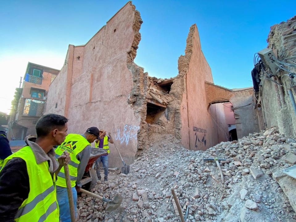 People work next to damage in the historic city of Marrakech, following a powerful earthquake in Morocco, September 9, 2023.