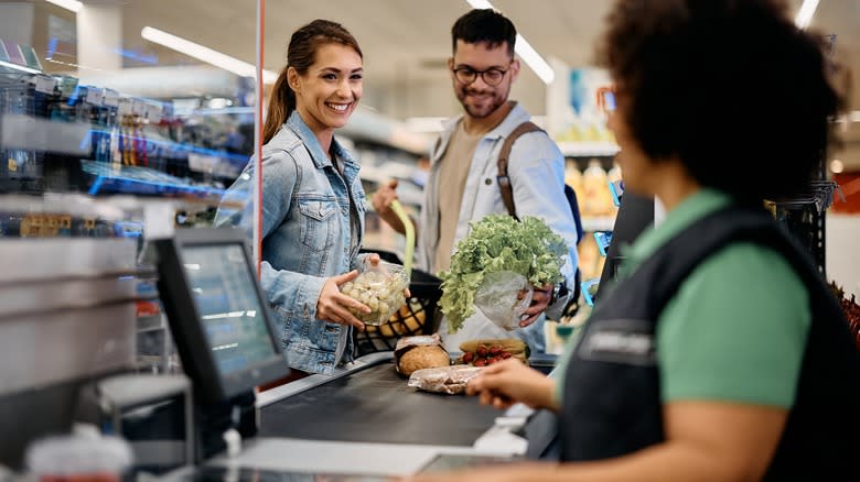 couple buying produce