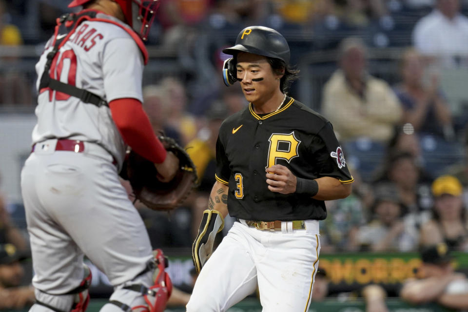 Pittsburgh Pirates' Ji Hwan Bae scores on a base hit by Connor Joe against the St. Louis Cardinals in the fourth inning of a baseball game in Pittsburgh, Tuesday, Aug. 22, 2023. (AP Photo/Matt Freed)