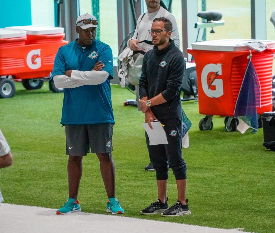 Miami Dolphins general manager Chris Grier and head coach Mike McDaniel watch training camp at Baptist Health Training Complex, Friday, July 28, 2023 in Miami Gardens.