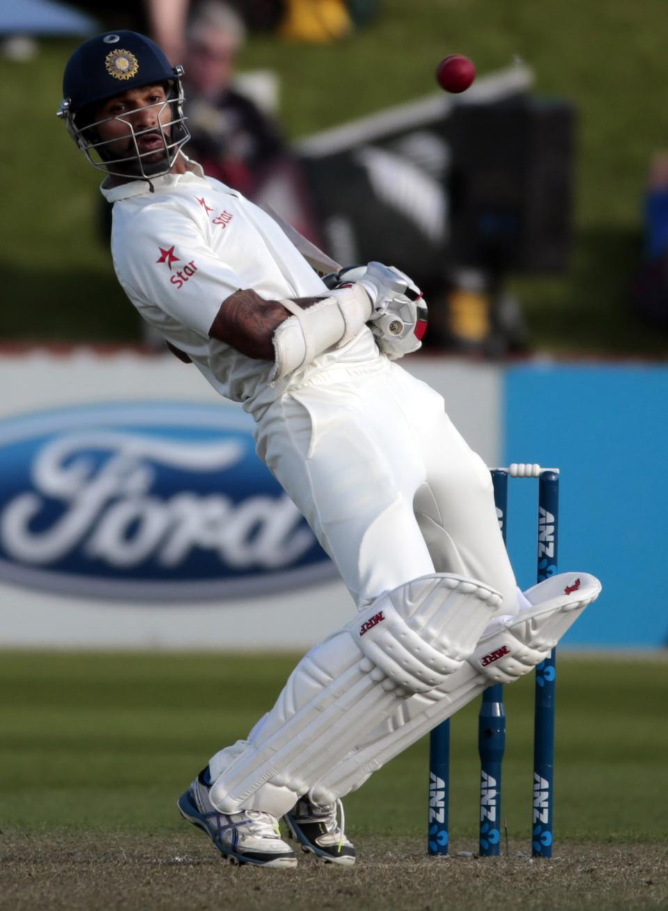 India's Shikhar Dhawan avoids a bouncer against New Zealand during the first innings on day one of the second international test cricket match at the Basin Reserve in Wellington, February 14, 2014.