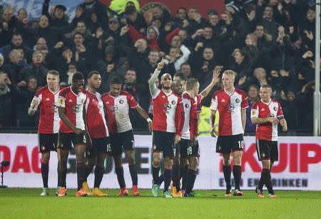 Karim El Ahmadi of Feyenoord (C) celebrates his second goal against Sevilla with teammates during their Europa League soccer match in Rotterdam November 27, 2014. REUTERS/Michael Kooren