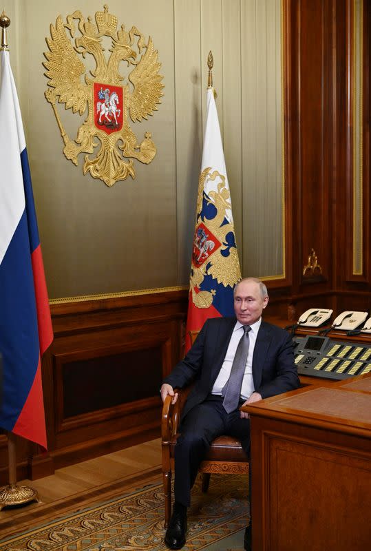 Russian President Putin answers questions about his article "On the historical unity of Russians and Ukrainians" in Saint Petersburg