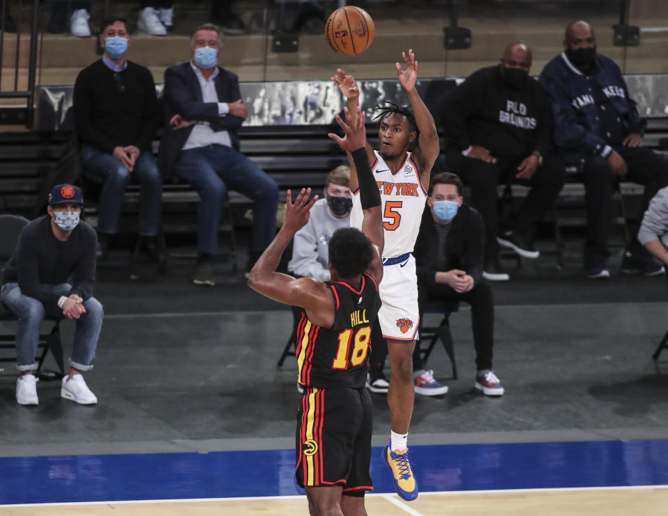 New York Knicks guard Immanuel Quickley (5) shoots against the Atlanta Hawks during overtime in an NBA basketball game Wednesday, April 21, 2021, in New York. (Wendell Cruz/Pool Photo via AP)