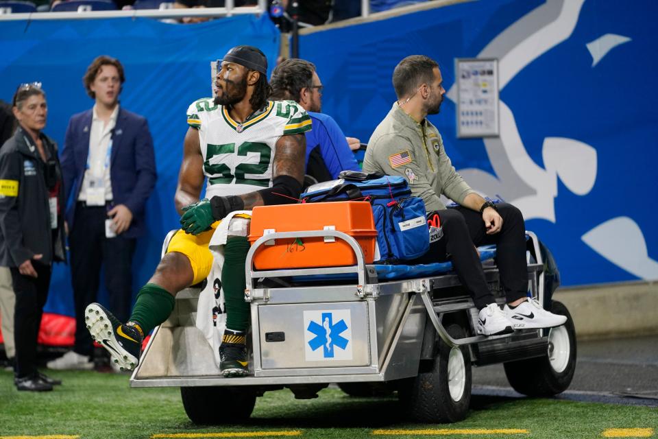 Green Bay Packers linebacker Rashan Gary (52) is carted off the field during the second half of a game against the Detroit Lions at Ford Field. Gary tore his ACL.