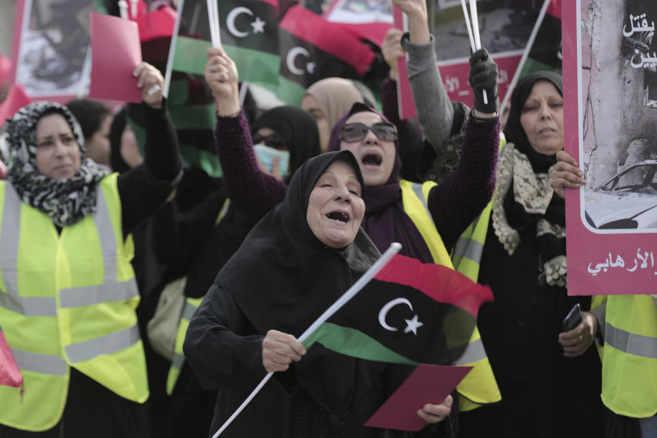 Women take part in a protest in Tripoli, Libya as they wave national flags and chant slogans against Libya's Field Marshal Khalifa Hifter, who is leading an offensive to take over the capital of Tripoli, Friday, April 19, 2019. (AP Photo/Hazem Ahmed)